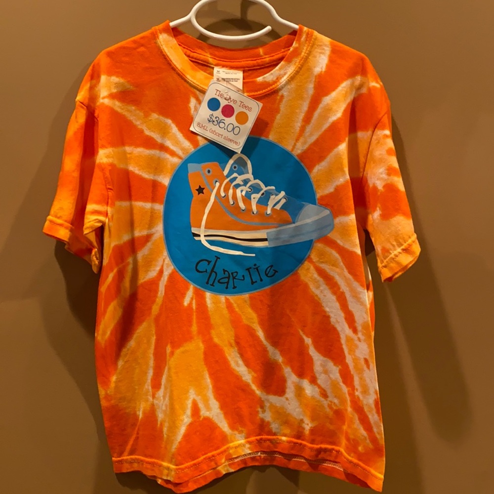 Youth M tie dye shirt with name Charlie on the center